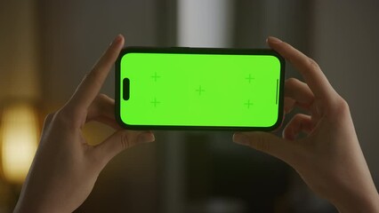 Horizontal smartphone with green screen close up