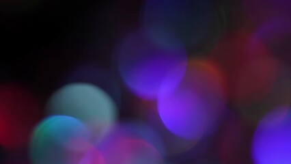 Wall Mural - Vivid Bokeh Blur Circles Shimmering On Dark. Amazing Lens Flares Light Leaks and Bokeh Motion Effect. 4k animated background or overlay. Neon Blur Lights Glowing.