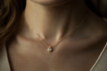 Gold Necklace With White Gemstone