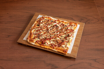 Wall Mural - One half of a delicious rectangular pizza with mushrooms, meat and barbecue sauce