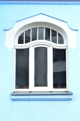 Wall Mural - view of blue building with white window