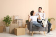 © New Africa - Happy couple in new apartment. Moving day