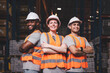 © Danai - Group worker in safety hat arms crossed smiling teamwork proud of success at warehouse, Logistic inventory teamwork concept