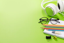 School Supplies And Stationery On Green