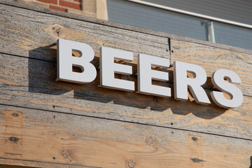 Wall Mural - text pub beers sign on facade wall front building cafe bar entrance in street