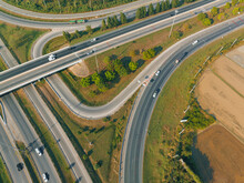 Top View Of The Road Runway Through The Green Aerial View Car Truck Drivers