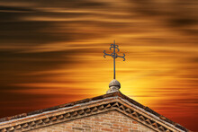 Close-up Of A Wrought Iron Religious Cross Against A Beautiful Sunset Sky. Treviso Cathedral (Duomo O Cattedrale Di San Pietro Apostolo), VI-XIX Century, Veneto, Italy, Europe.