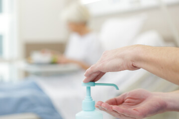 woman doctor using a hand sanitizer