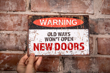 Wall Mural - Old Ways Won't Open New Doors. Warning sign with text