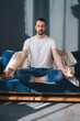 © Strelciuc - Peaceful millennial man relaxing with eyes closed on comfortable sofa meditating at home in the morning. Life balance concept. Calm mindset, praying and relax