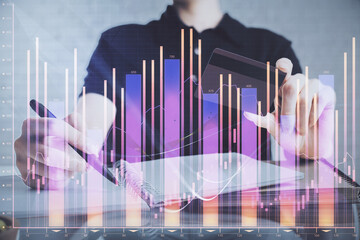 Wall Mural - Double exposure of man hands holding a credit card and Forex graph drawing. Stock trading and digital fintech in Internet E-commerce concept.