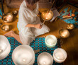 Woman in Crystal Singing Bowls in Sound Healing Therapy Session ,. A tranquil essence for mental health, stress relief, and inner peace  