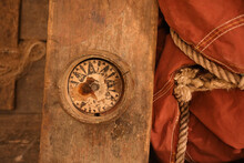 A Close-up Of An Old Broken Compass On A Boat
