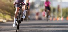 Female Cyclist Riding Racing Bicycle. Cycling Competition, Cyclist Athletes Riding A Race	