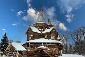 Wall Mural - old houses and household buildings made of wooden beams according to old technologies in the vicinity of Veliky Novgorod in winter