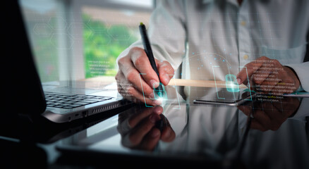 Internet technology, cyber security network, the concept of protecting personal data. Businessman employing laptop and digital tablet, along with a network security system, developing digital software