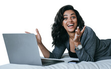Excited African American Young Woman In Grey Cardigan Toothy Smiles Laying On Couch With Laptop Surprised Opened Mouth In Disbelief Amazed By New Gadget. Student Against Transparent Background. Winner
