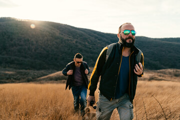 Two friends hiking in the hills