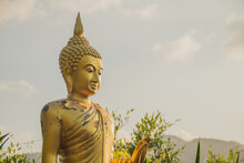 Golden Buddha With A Mountain View Background