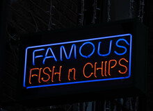 Neon Sign On Fish And Chip Shop