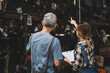 © chokniti - Asian woman customer talking with professional mechanic worker or workshop owner, client checking a maintenance job with garage automobile technician, business of car repair transportation service