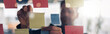 © Kostiantyn - Close up of businessman is glues sticky notes on motivation board in modern office