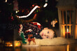 boy child lying near christmas tree christmas mood