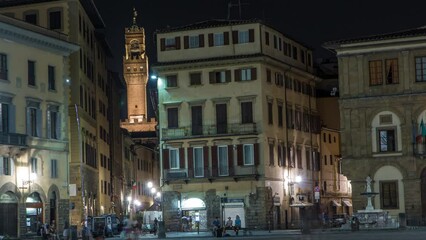 Poster - Panoramic view of Piazza Santa Croce night timelapse in Florence, Tuscany, Italy. Tower of Palazzo Vecchio on background. Illuminated historic buildings