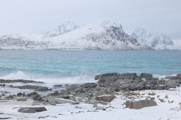 Wall Mural - Harsh winter landscape in Lofoten Archipelago, Uttakleiv Beach, Norway, Europe. Cold landscape in Lofoten Islands.