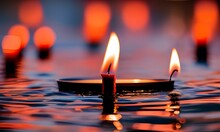 Red Candles Floating On Water