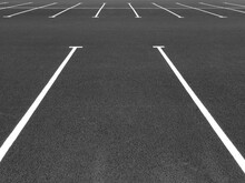 Marking Road Lines In Parking Lot. Parking Markings, Black And White Stripes On Bitumen. Parking Place At Store. Empty Parking Lot.