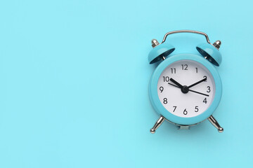 Wall Mural - Alarm clock on blue background