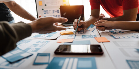 Wall Mural - close up ux developer and ui designer brainstorming about mobile app interface wireframe design at m