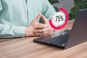 Adult man using a laptop computer for download software and waiting to loading digital business data form website, very slow internet form wifi. Concept of waiting for load of loading symbol.
