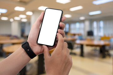 Wall Mural - Man using smartphone at abstract blurred