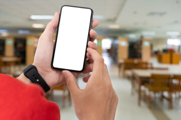 Wall Mural - Man using smartphone at abstract blurred