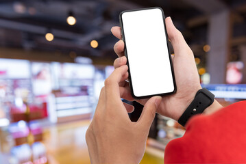 Wall Mural - Man using smartphone at abstract blurred