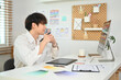 © Prathankarnpap - Professional web developer creating website wireframe sketches at modern creative office