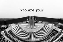 Who Are You Phrase Closeup Being Typing And Centered On A Sheet Of Paper On Old Vintage Typewriter Mechanical