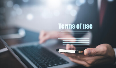 Businessmen hold smartphone of Terms of use concept, online banking check budget planning concept banner for website header design, Terms of use business concept. Terms and conditions of contract.