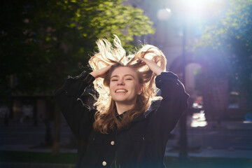 smiling natural looking beauty teenage girl with blond hair outdoor on the sunset. Looking at the camera .High quality photo