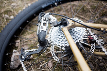 A Detailed Image Of A Mountain Bike Rear Wheel And Rear Derailleur.