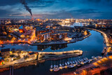 Fototapeta Londyn - Gdansk city by the Motlawa river with the harbour area at dusk, Poland.