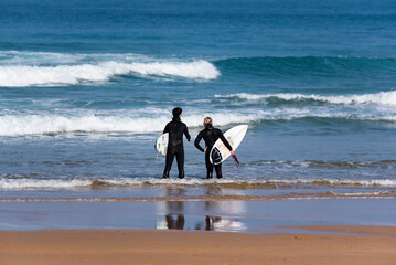 Surfers preparing to enter the sea