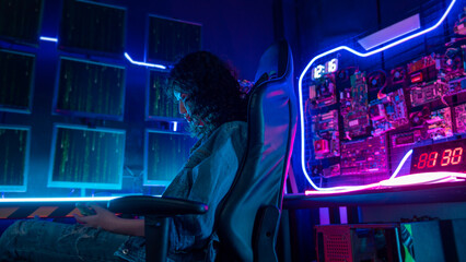 an asian woman programmer is working in her computer room , futuristic technology concept