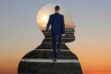 Thinking About Steps To Success. Businessman Climbing Up Stairs Inside Of Man's Silhouette