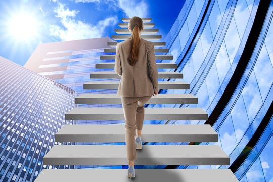 Wall Mural - Steps to success. Businesswoman climbing up stairs among buildings