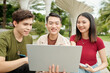 © DragonImages - Joyful college students discussing new application they created for competition