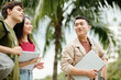 © DragonImages - Young man helping freshmen to find library on college campus