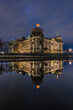 Reichstag at night. Illuminated government building in Berlin. Government district in the center of the capital of Germany. River Spree with reflection on the water surface